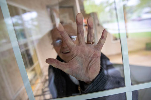 Woman touching window