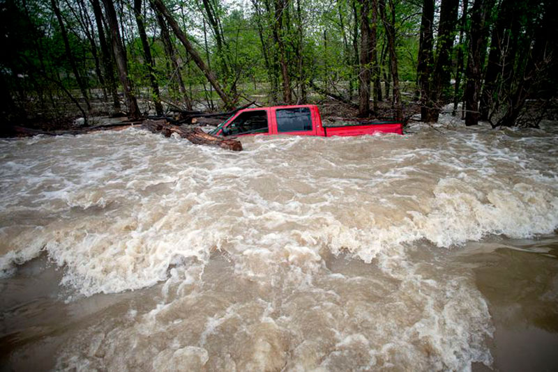 Photo by Jake May of truck in floodwater