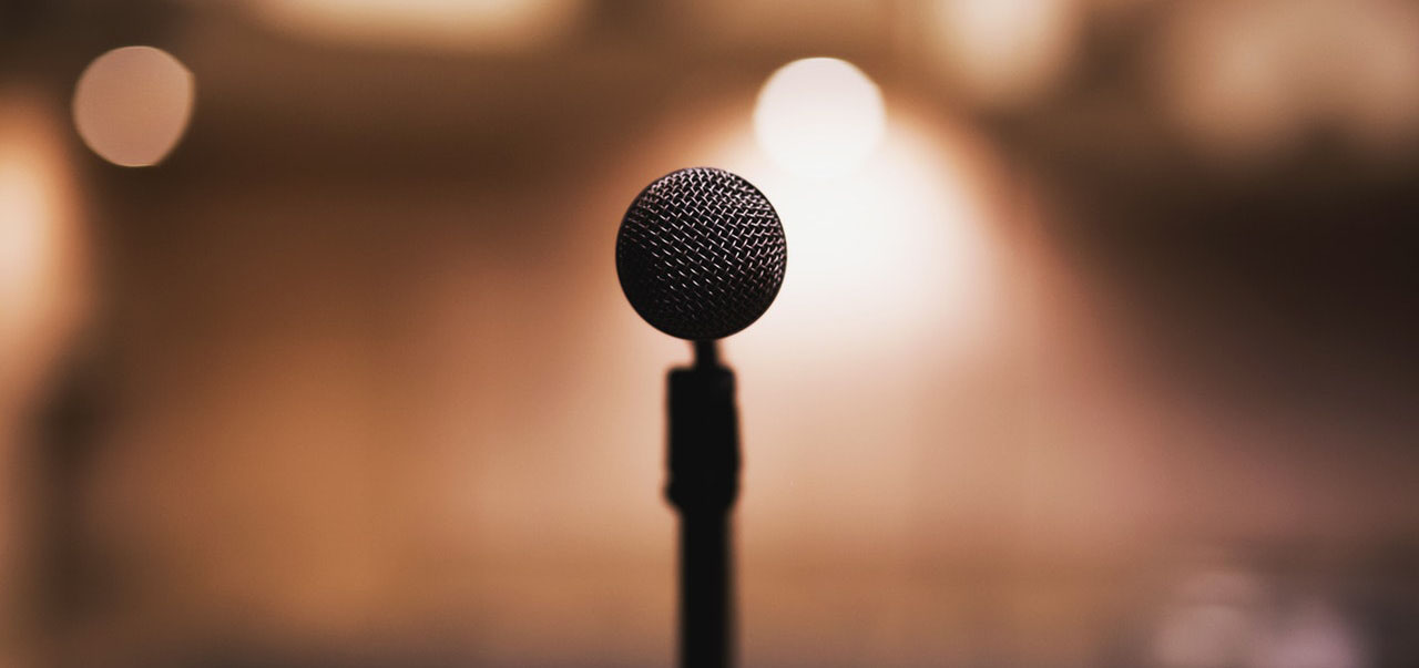 Photo of a black microphone with a shallow depth of field