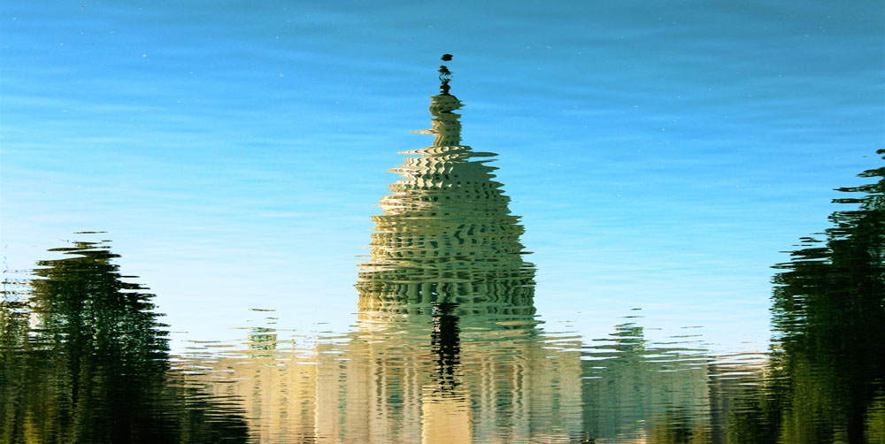 U.S. Capitol building reflected in the water on the mall